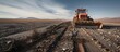Massive Bulldozer Clearing Path Across Barren Landscape in Arid Desert Environment