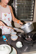 © Alvaro Lavin/Stocksy - Chef pouring preparation into bowls.