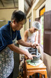 © Alvaro Lavin/Stocksy - People grinding spices in a mortar.