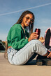 © VICTOR TORRES/Stocksy - Happy Black Woman Enjoying a Beverage Outdoors