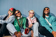 © VICTOR TORRES/Stocksy - Trendy multi-ethnic friends enjoying a sunny day together outdoors