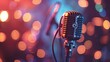 A close up of a vintage microphone against a blurred background of bokeh lights.