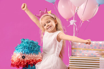 Canvas Print - Cute little girl with pinata, Birthday gifts and balloons on purple background