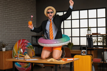 Sticker - Screaming male office worker in sunglasses and hat with cocktail on table in office. Summer vacation concept