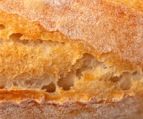 Canvas Print - Ruddy crust of bread as an abstract background. Texture