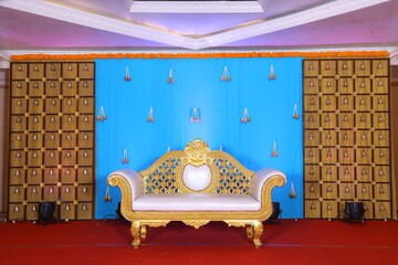 Wall Mural - stage decoration with chrome backdrop with a couch at the centre