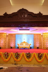Wall Mural - Indian style stage decoration with blue backdrop decorated with lotus flowers and bells