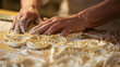 © Oleksandr - A closeup of a bakers hands kneading intricate shapes into dough. displaying the skill and creativity in bakery. The spotlight is on meticulous kneadings with baking tools
