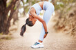 © peopleimages.com - Health, fitness and woman stretching body in park for running, training or morning cardio in nature. Wellness, exercise and female runner in forest for workout, performance or resilience challenge