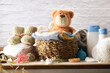 Clothes and accessories for clothing and baby grooming on table