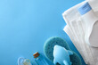 Baby bath accessories isolated on blue table
