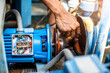 Selective focus to hand of plumber repair and remove motor of centrifugal water pump. Plumbers working to installation centrifugal water pump motor.