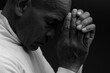 praying to god with hands together Caribbean man praying on black background with people stock photos stock photo stock image