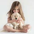 A young girl gently embraces a sleepy Labrador puppy, showcasing the innocence and friendship between a child and a pet.