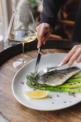 Wall Mural - Sea bass fillet with asparagus. Lunch, brunch, food photography, healthy food, diet.