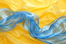 Abstract Blue And Yellow Silk Fabric With Blue Ribbon On Yellow And Blue Background, Textile Texture Background Concept