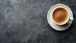 White coffee cup on dark surface. Top view. Isolated on dark background. Room for copy space.	