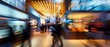 Abstract blur of business hall at trade show captures lively.