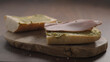 making sandwich, add turkey slices on ciabatta on olive wood board