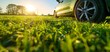 A car next to a vibrant green field, with direct sunlight on the tire