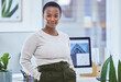 © peopleimages.com - Corporate, portrait and black woman in office for confidence, career pride or ambition with positive mindset. Smile, worker and female admin clerk for professional, determination or company goal