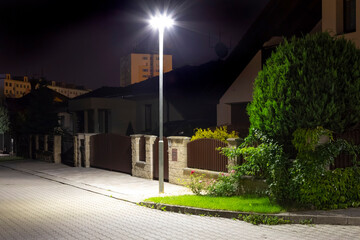 Poster - modern led illumination on quiet street at night