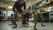 In a dynamic R&D environment, the engineer tests a quadrupedal robot's locomotion capabilities, exploring adaptive control strategies for varied terrain.