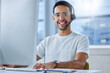 © peopleimages.com - Man, portrait and headset at computer or call centre for technical support, telemarketing or crm. Male person, face and smile for customer service at help desk as it advisor, consultation or contact