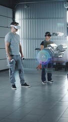 Wall Mural - two technicians check a car engine using virtual reality technology in a workshop. experts discuss t