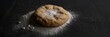 Cookie with flour on dark table copy space