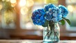 Tranquil blue hydrangeas in glass vase on wooden table with warm bokeh lights
