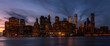 New York city NYC Lower Manhattan Skyscraper skylines building cityscape sunset at dusk from New Jersey. Lower Manhattan is the largest financial district in the world.