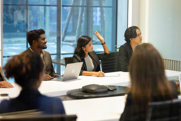 Business meeting - Group of diversity men and women sitting in conference room and smiling at meeting research plan in boardroom. Professional business people brainstorming and teamwork concept.