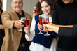 © NVB Stocker - Closeup hand holding glassware. Business people celebrate making a toast on event party at office. Celebration Success Concept