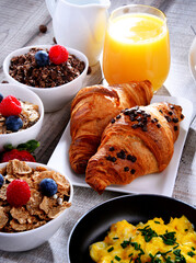Wall Mural - Breakfast served with coffee, juice, croissants and fruits