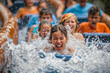 People getting soaked on a log flume ride, water park, summer fun, vacation