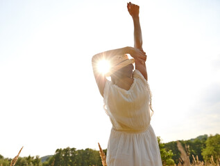 Wall Mural - Back, stretching and woman with freedom, sunshine and outdoor with celebration and carefree. Rear view, nature and girl with environment and countryside with vacation and holiday with getaway trip