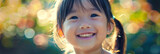 Fototapeta Do akwarium - Close-up of a happy little asian girl smiling