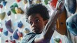 A young child is focused while indoor rock climbing