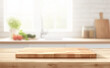 Empty wooden table top with a blurred kitchen interior background for product display montage, white and wood color scheme, blurred vegetables in the BG, kitchen counter with modern design.