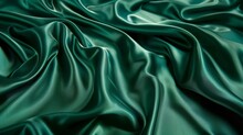 A Captivating Arrangement Of Undulating, Jade-toned Fabric Forms A Visually Striking Pattern, Resembling The Ebb And Flow Of Water.