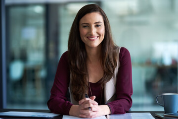 Poster - Portrait, happy and businesswoman in office by desk with document for planning, solutions and ideas for startup company. Confident, female person and paper for information on creative decisions