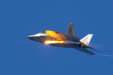 Wall Mural - Side view of a F-22 Raptor deploying a flare