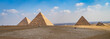 The Giza pyramid complex  in Egypt is home to the Great Pyramid  of Khufu, the Pyramid of Khafre, and the Pyramid of Menkaure, along with  smaller pyramids 
