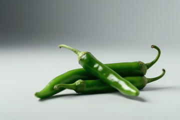 Wall Mural - Fresh green chilli on white background