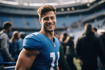 Young handsome male athlete standing at ground