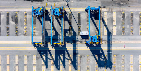 Wall Mural - RTG cranes are lifting containers at the port.