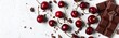 Scrumptious Cherries and Dark Chocolate Chunks on White Background. top view. flat lay. copy space