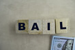 Concept of The wooden Cubes with the word BAIL on wooden background.