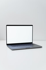 macbook laptop with white screen on a white table with white background, laptop screen mocap